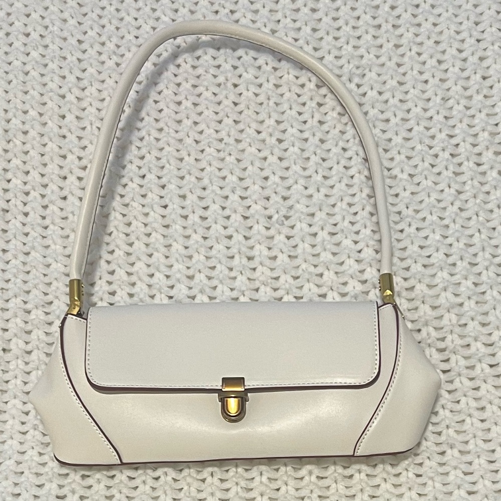 White purse with maroon detailing